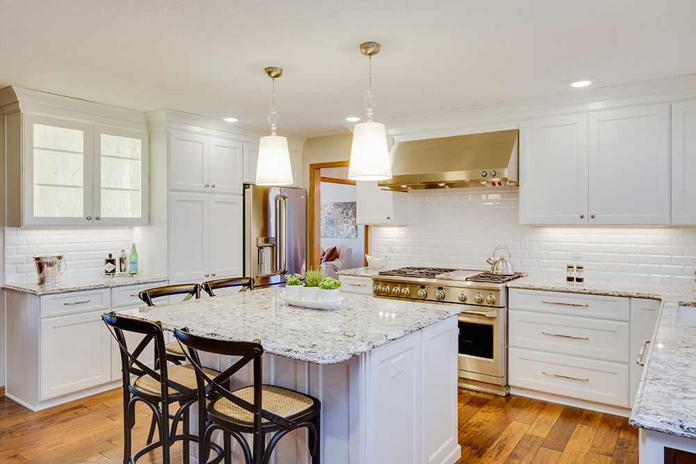 This West Des Moines 2 story features a white on white kitchen with island
