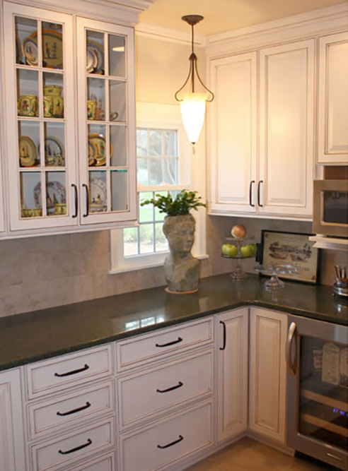 white kitchen with glass kitchen cabinet doors 