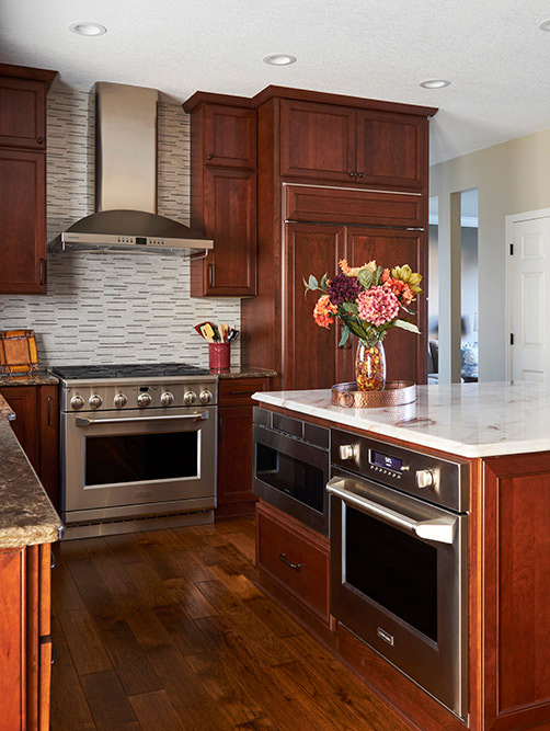 classic kitchen with cherry finish cabinets